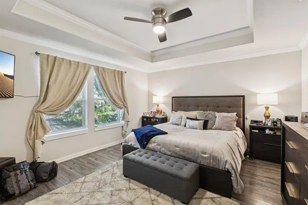 a bedroom with a large bed and a large window