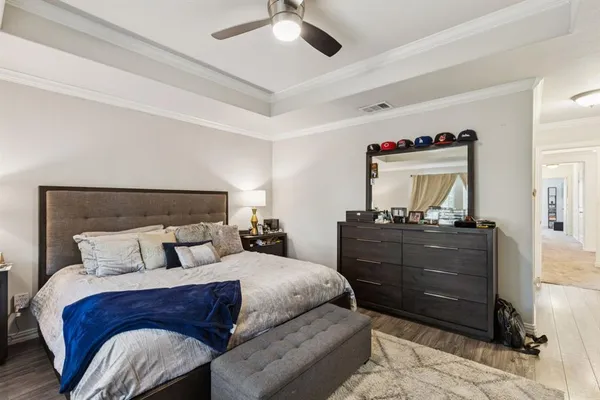 a bedroom with a bed and a dresser
