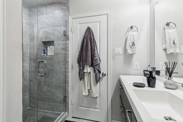 a bathroom with a sink and mirror
