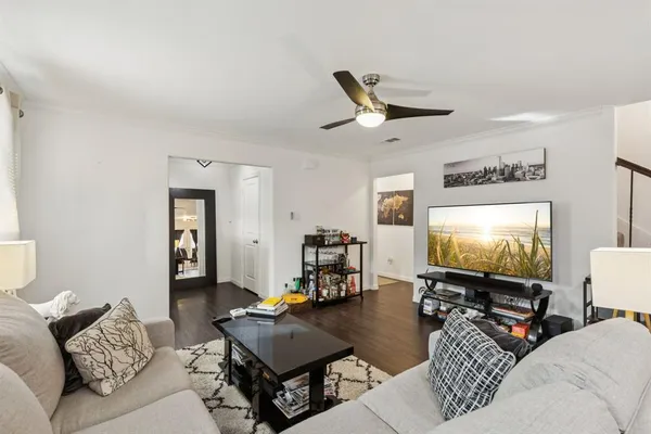 a living room with furniture and a flat screen tv