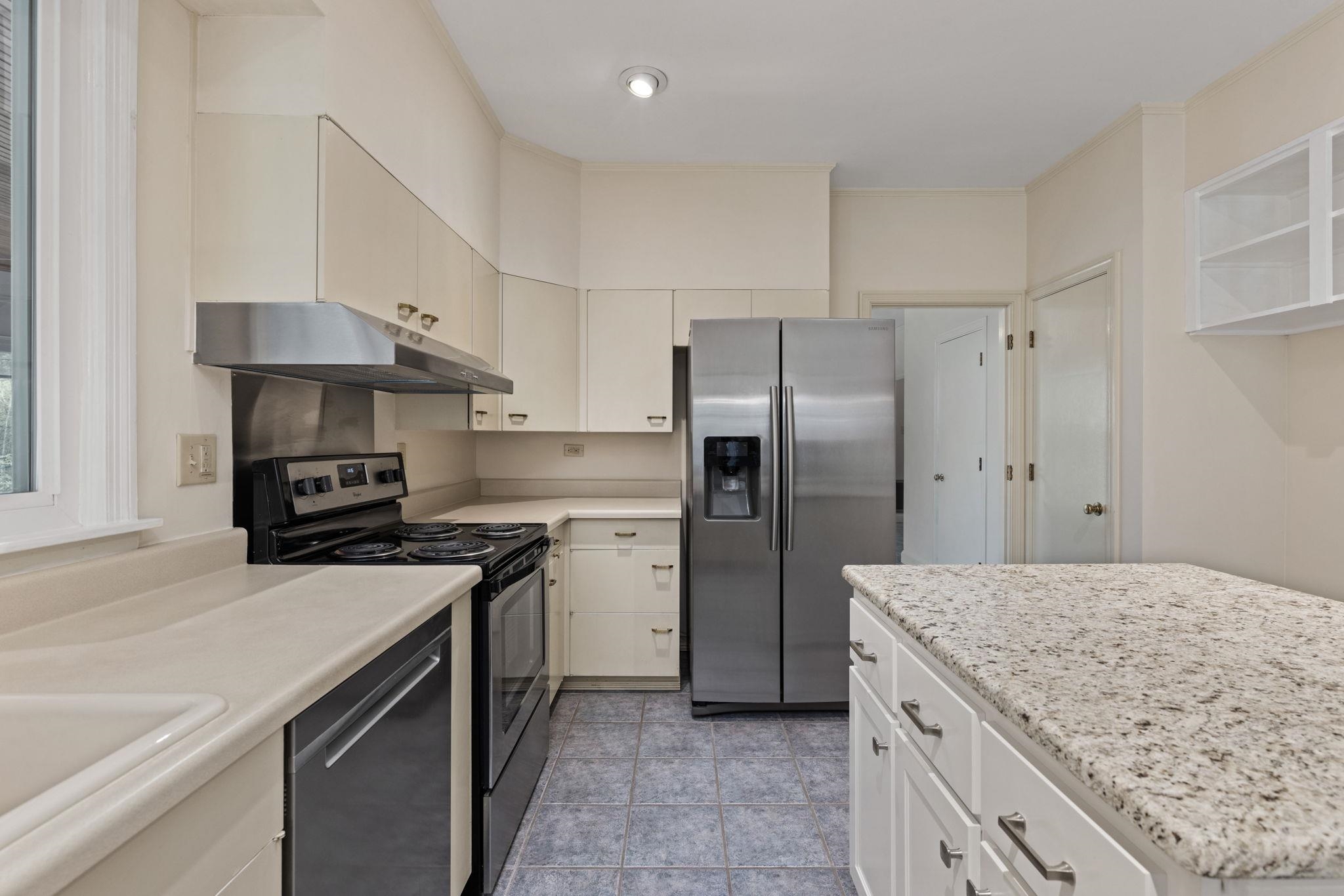 1906 Willow Road Corinth, MS 38834 - Photo 11 of 40 a kitchen with a sink stove and refrigerator