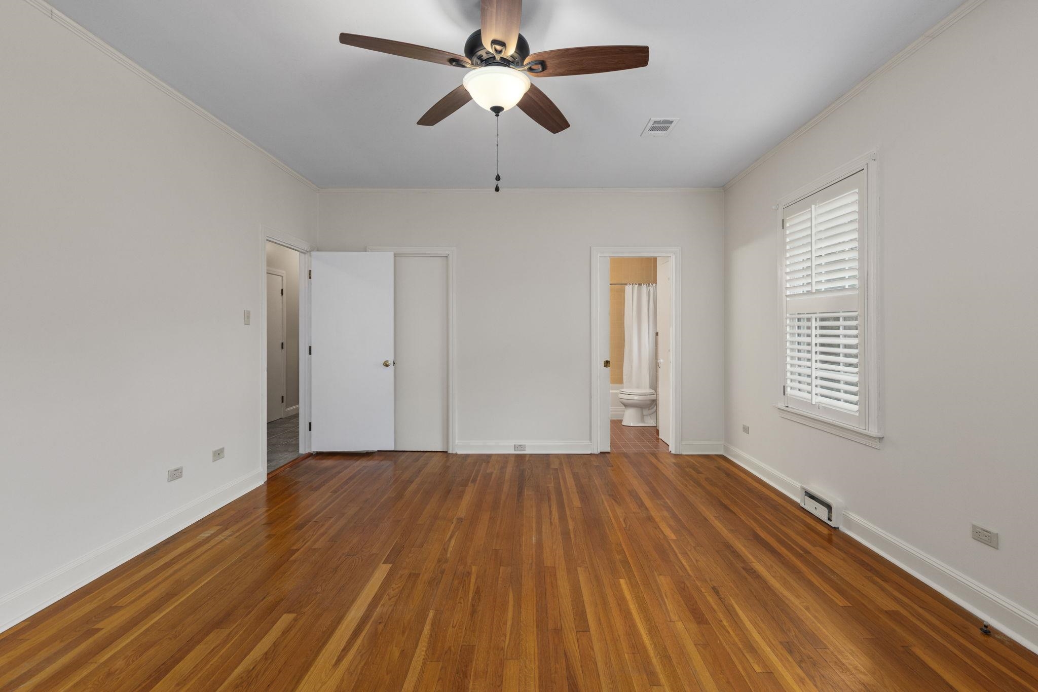 1906 Willow Road Corinth, MS 38834 - Photo 18 of 40 a view of an empty room with chandelier fan and a window
