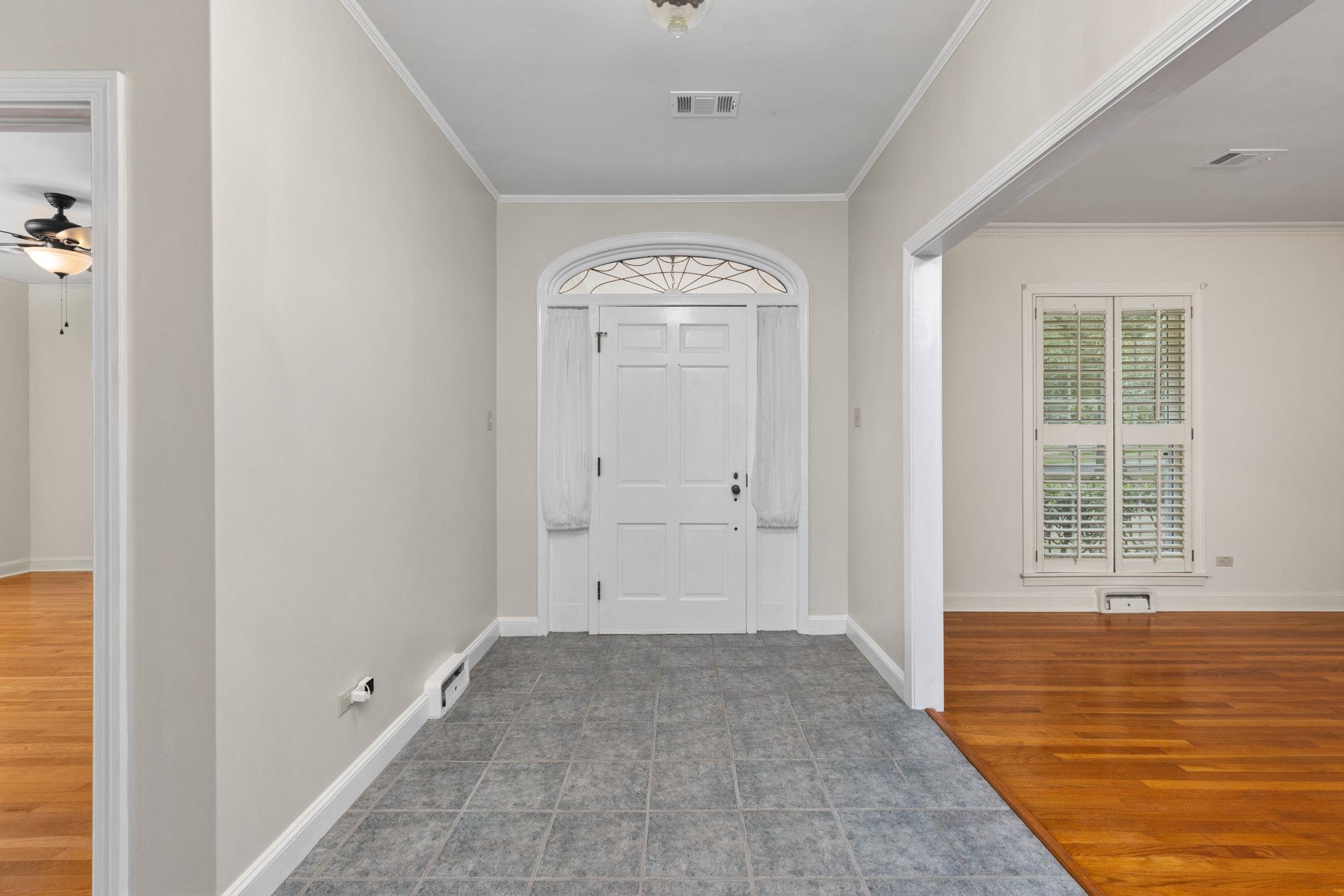 1906 Willow Road Corinth, MS 38834 - Photo 2 of 40 an empty room with wooden floor and windows