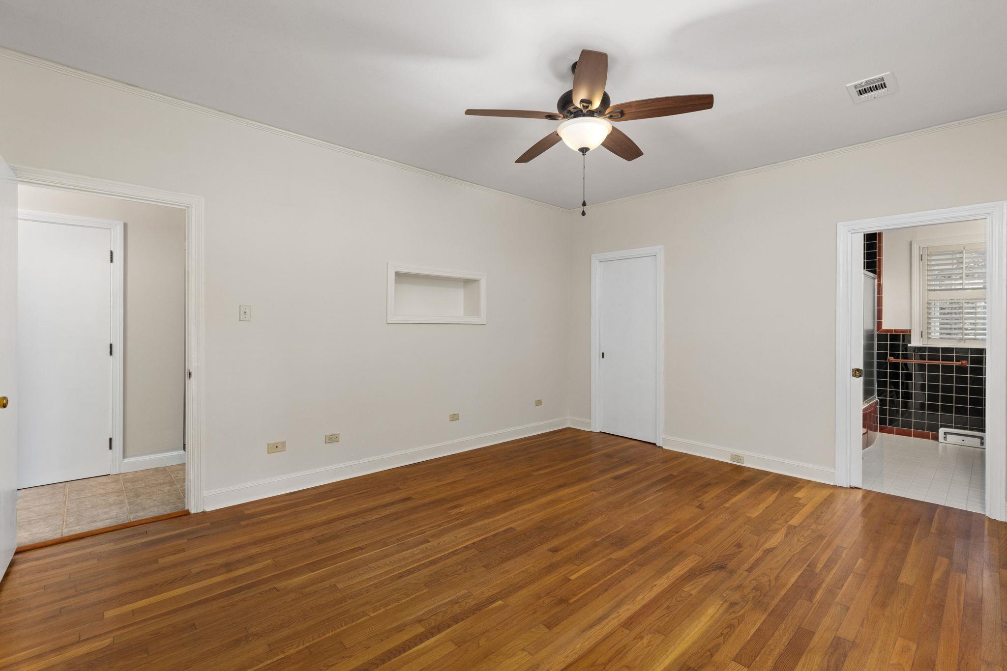 1906 Willow Road Corinth, MS 38834 - Photo 21 of 40 a view of empty room with wooden floor and ceiling fan