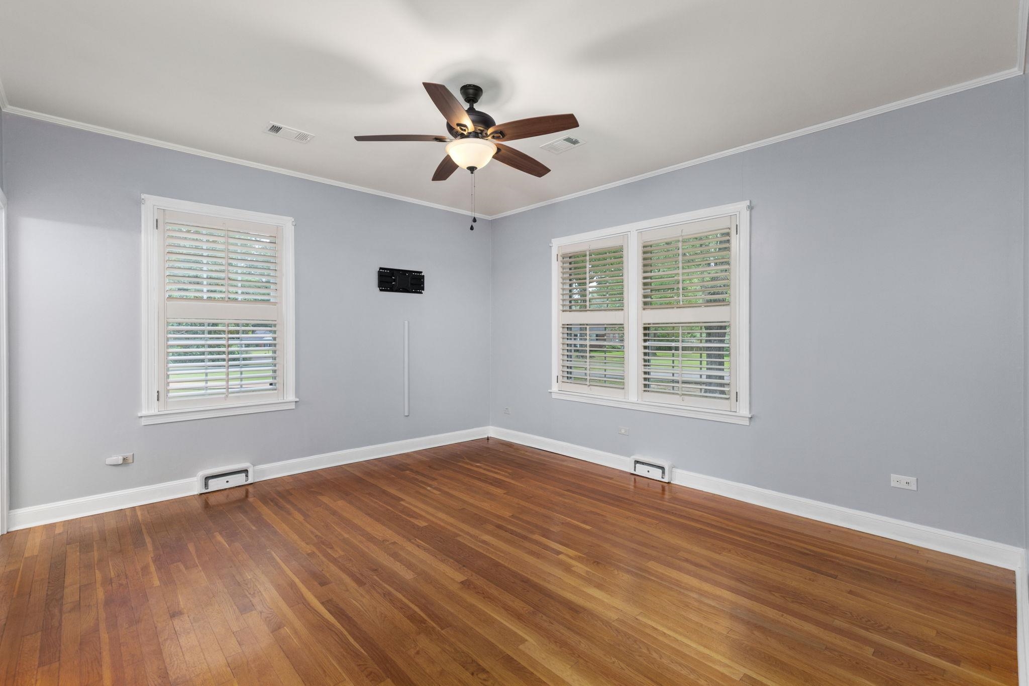 1906 Willow Road Corinth, MS 38834 - Photo 23 of 40 a view of an empty room with wooden floor and a window