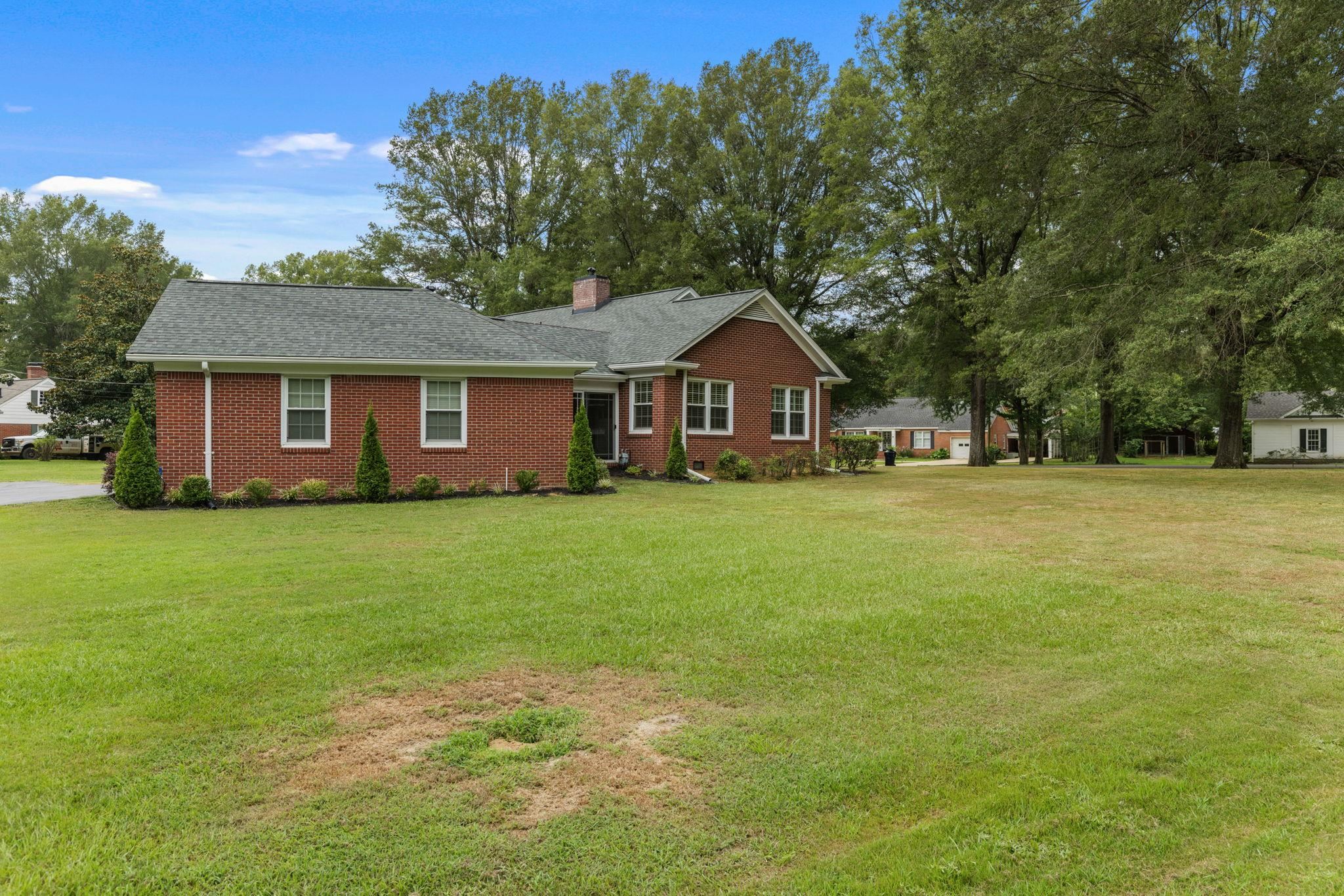 1906 Willow Road Corinth, MS 38834 - Photo 31 of 40 a front view of a house with a garden