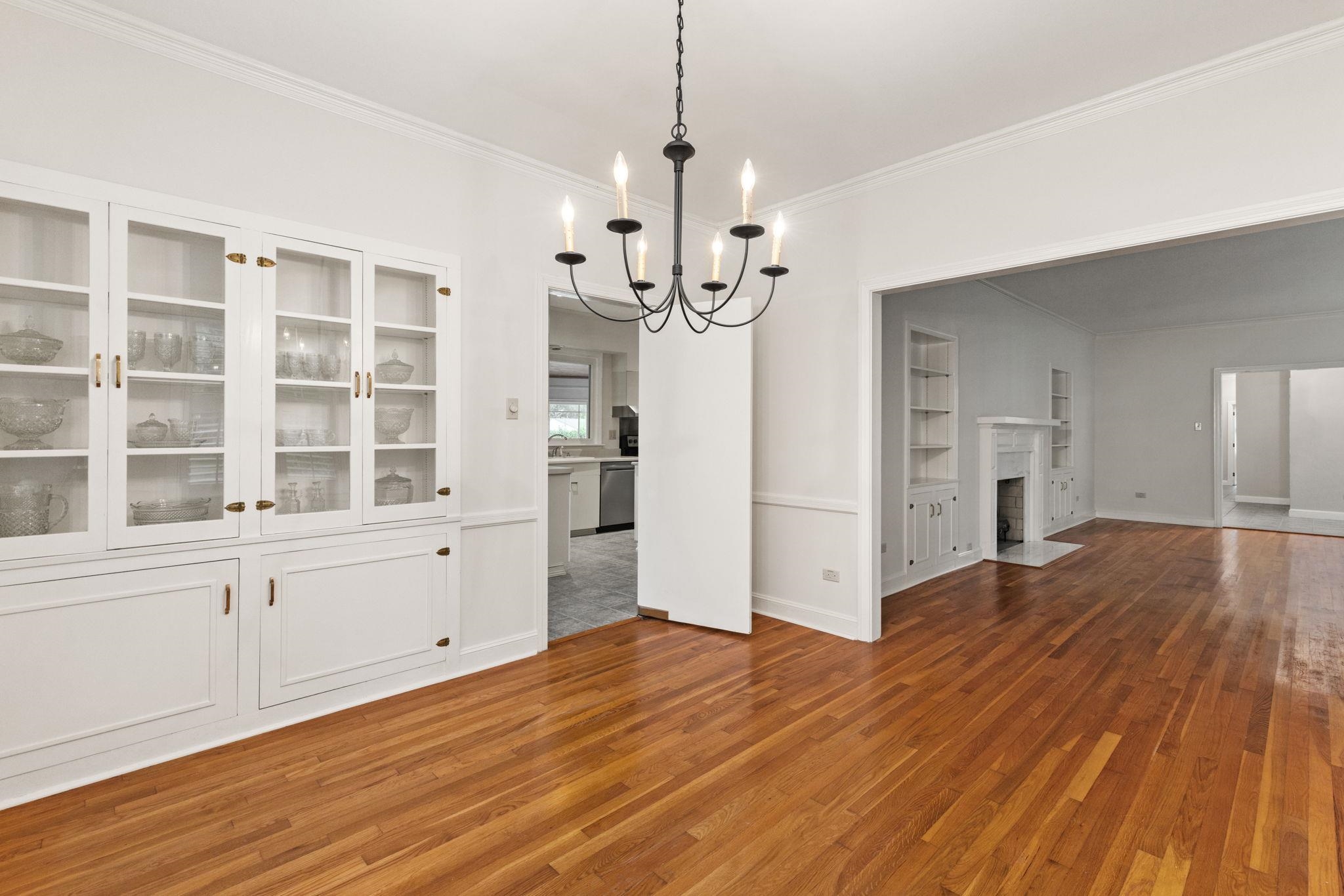 1906 Willow Road Corinth, MS 38834 - Photo 7 of 40 a view of a kitchen with wooden floor and a ceiling fan