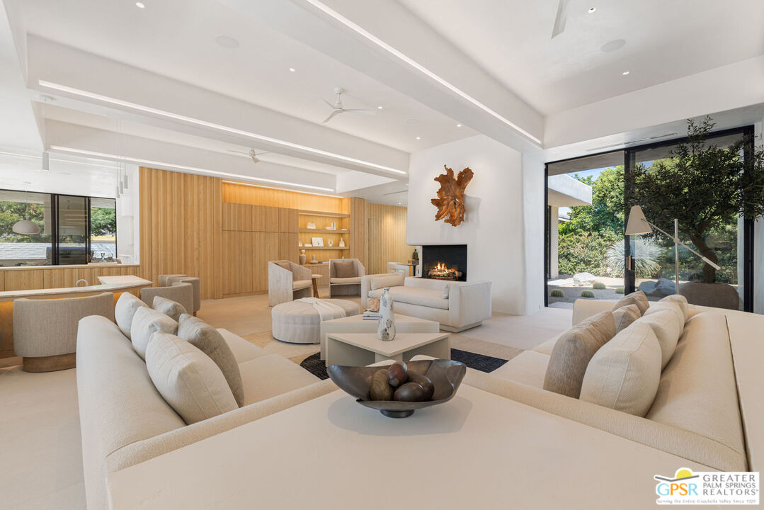 71000 Tamarisk Lane Rancho Mirage, CA 92270 - Photo 17 of 58 a living room with furniture and a large window