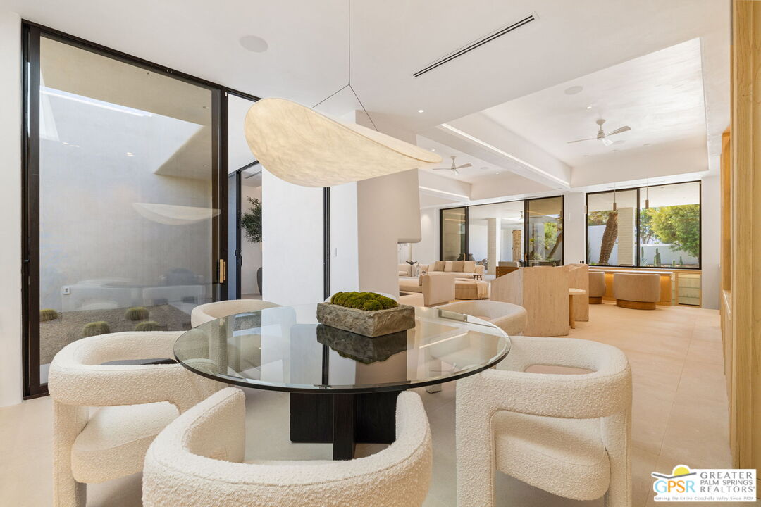 71000 Tamarisk Lane Rancho Mirage, CA 92270 - Photo 21 of 58 a living room with furniture and a large window