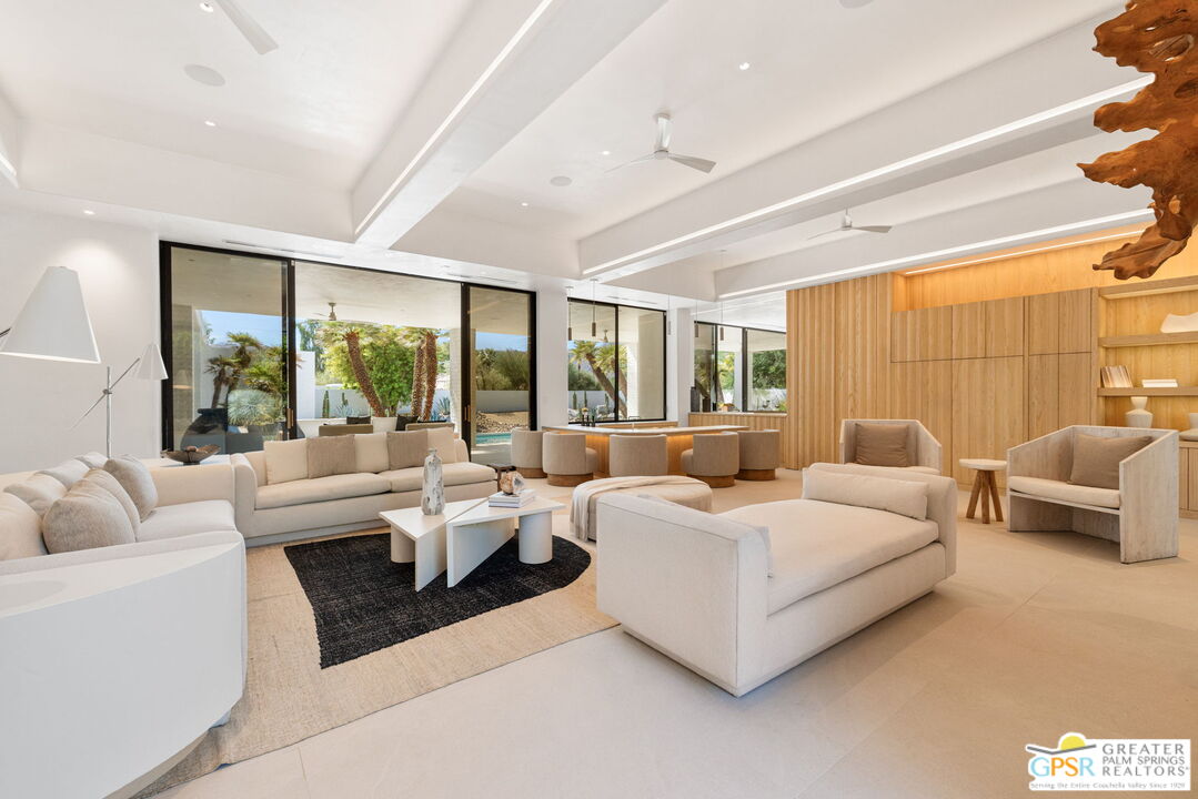 71000 Tamarisk Lane Rancho Mirage, CA 92270 - Photo 23 of 58 a living room with furniture and a large window
