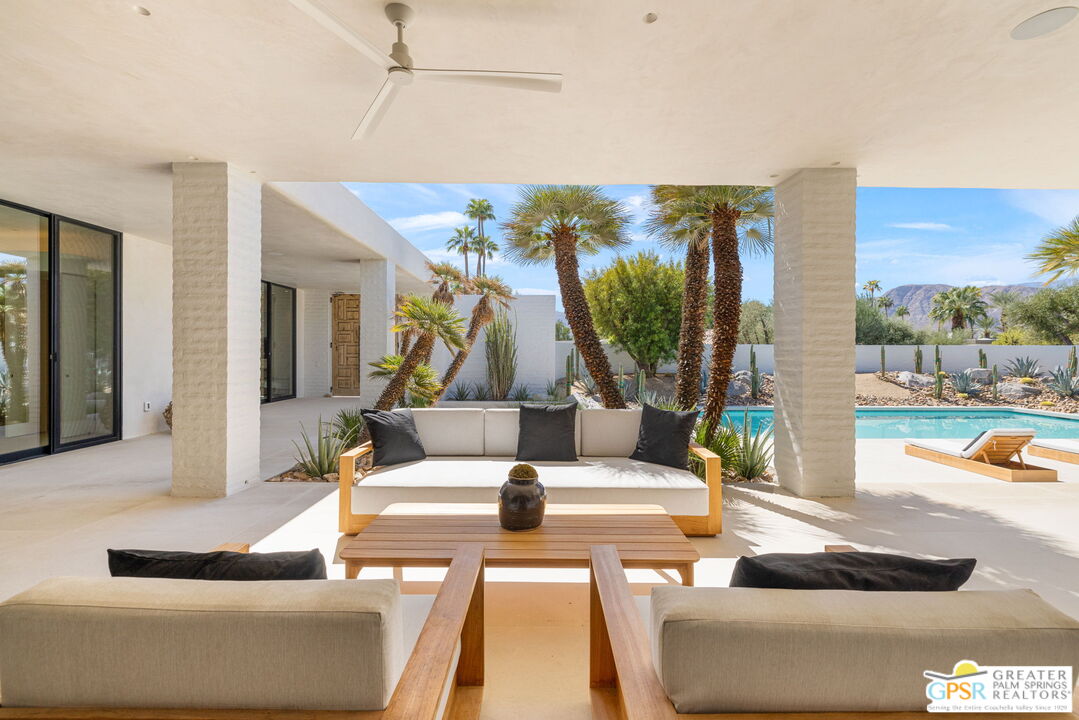 71000 Tamarisk Lane Rancho Mirage, CA 92270 - Photo 29 of 58 a living room with furniture and a large window