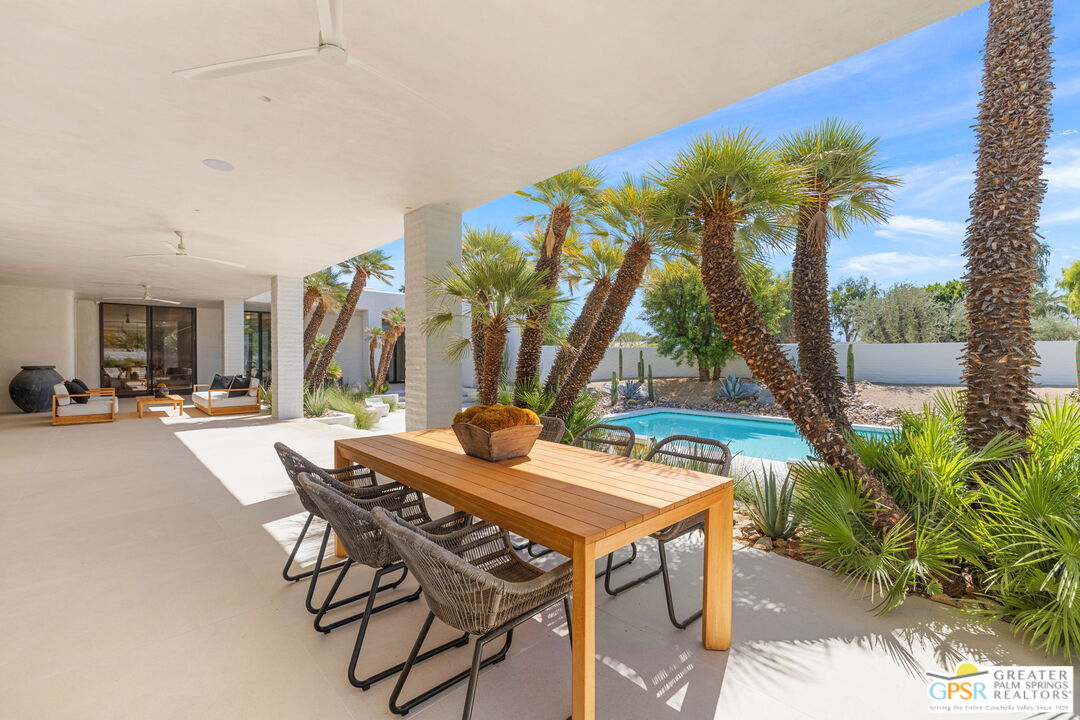 71000 Tamarisk Lane Rancho Mirage, CA 92270 - Photo 30 of 58 a view of an outdoor space with a table and chairs