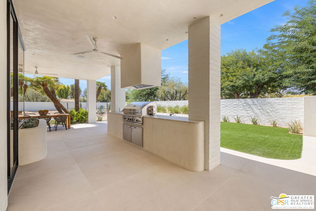 71000 Tamarisk Lane Rancho Mirage, CA 92270 - Photo 32 of 58 a view of a porch with furniture and garden