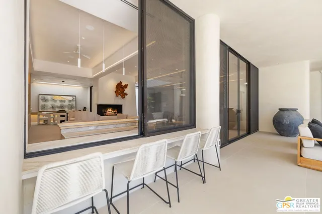 a living room with couches and painting on the wall