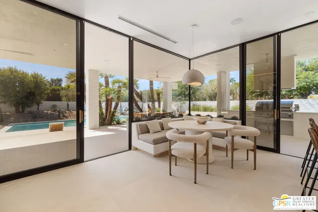 a bathroom with a double vanity sink and a large mirror