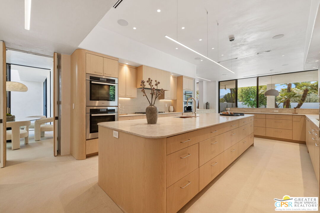 71000 Tamarisk Lane Rancho Mirage, CA 92270 - Photo 39 of 58 a large white kitchen with a large window