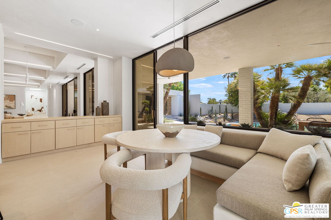 71000 Tamarisk Lane Rancho Mirage, CA 92270 - Photo 40 of 58 a living room with furniture and a large window