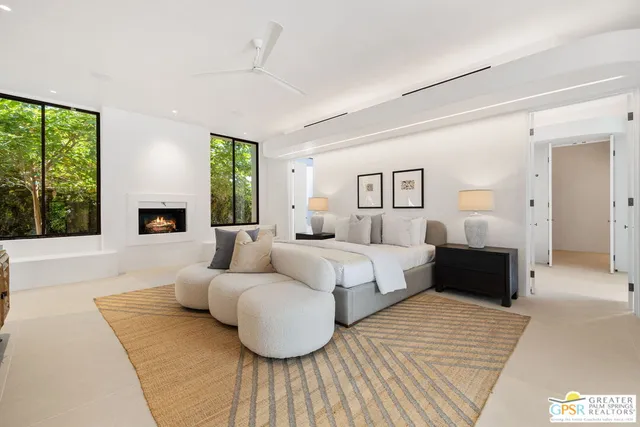 a bedroom with a bed and a couch