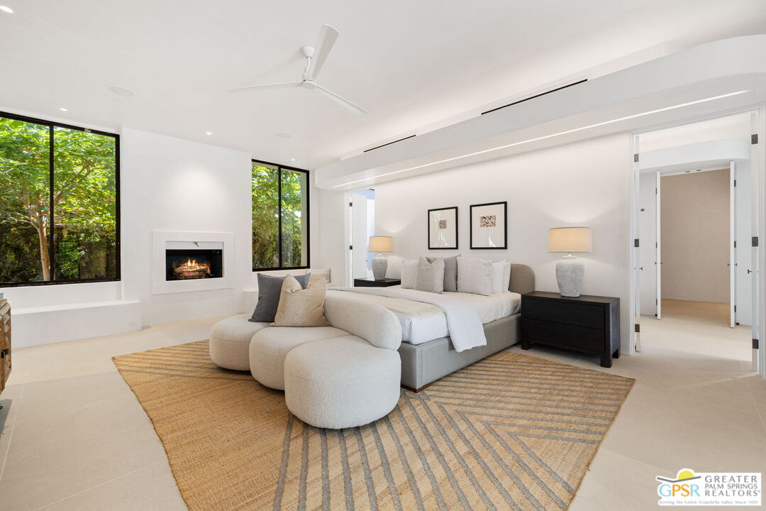 71000 Tamarisk Lane Rancho Mirage, CA 92270 - Photo 41 of 58 a bedroom with furniture and a large window