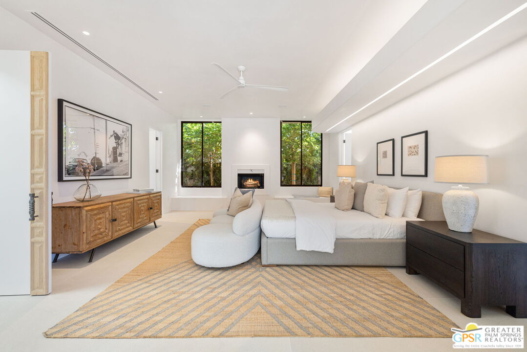71000 Tamarisk Lane Rancho Mirage, CA 92270 - Photo 42 of 58 a living room with couches and painting on the wall