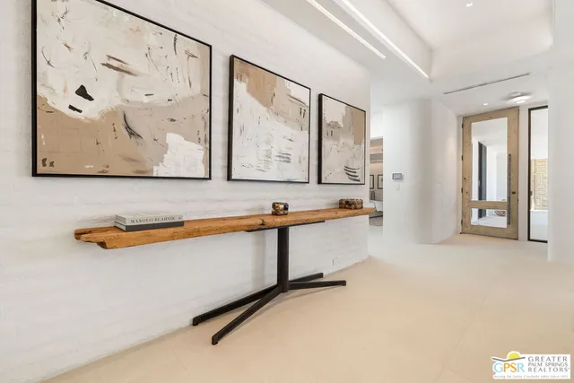 a bathroom with a double vanity sink toilet and a window