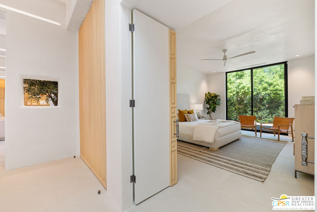 71000 Tamarisk Lane Rancho Mirage, CA 92270 - Photo 48 of 58 a bedroom with a bed and a couch