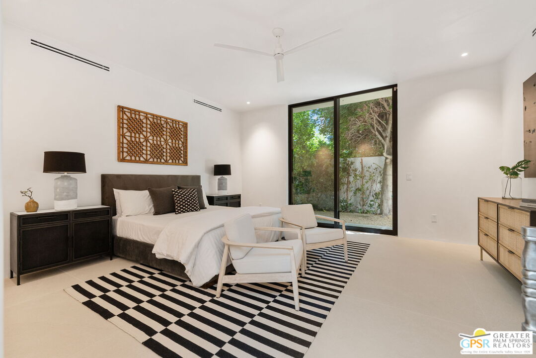 71000 Tamarisk Lane Rancho Mirage, CA 92270 - Photo 53 of 58 a bedroom with a bed and a window