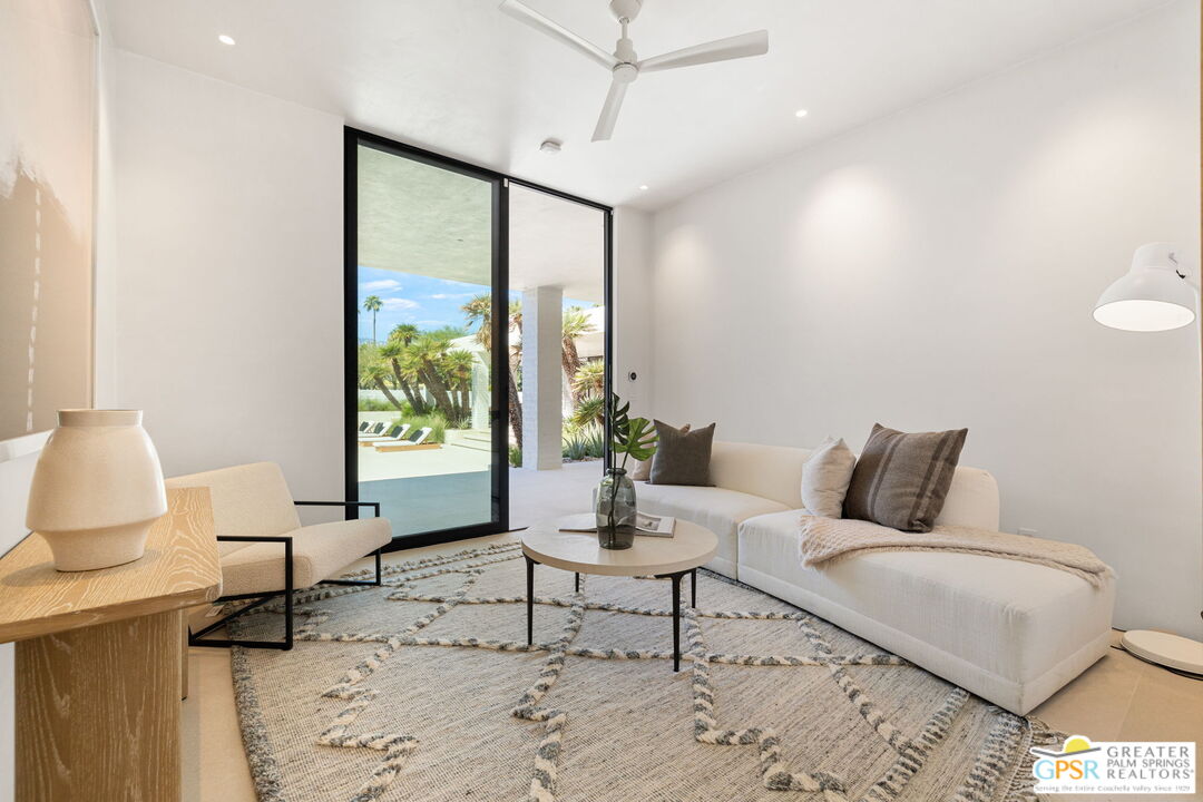 71000 Tamarisk Lane Rancho Mirage, CA 92270 - Photo 55 of 58 a living room with furniture and a window