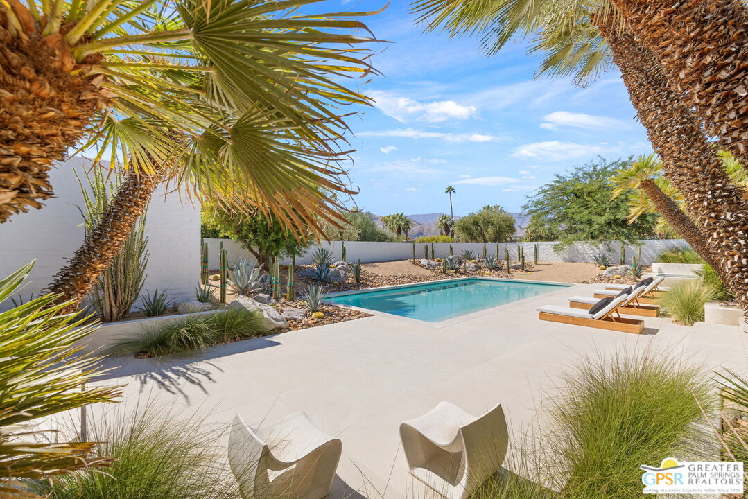 71000 Tamarisk Lane Rancho Mirage, CA 92270 - Photo 6 of 58 a view of a house with swimming pool and sitting area