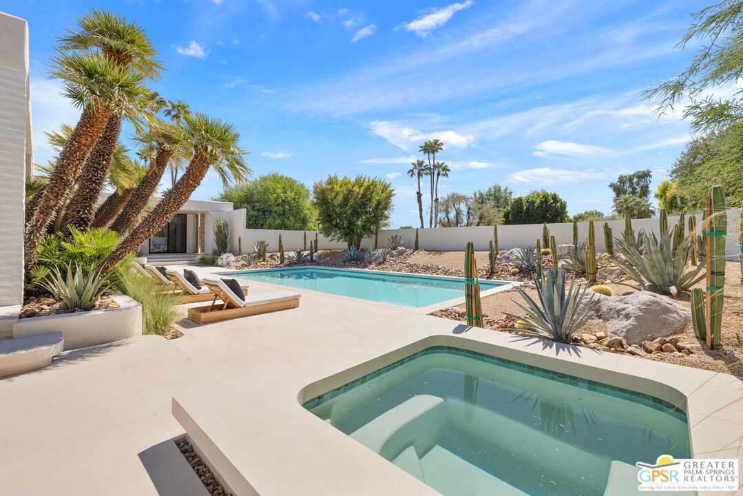 71000 Tamarisk Lane Rancho Mirage, CA 92270 - Photo 7 of 58 a view of a backyard with swimming pool