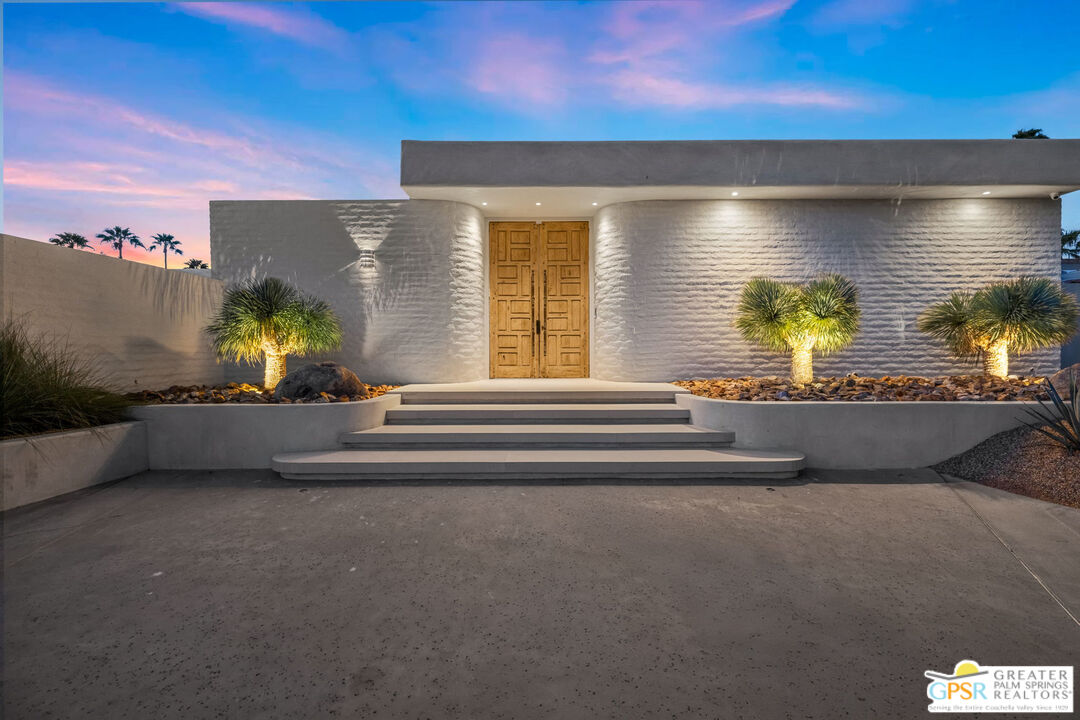 71000 Tamarisk Lane Rancho Mirage, CA 92270 - Photo 10 of 58 a view of lobby with a floor to ceiling window and potted plants