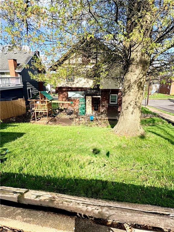 356 Locust Avenue Washington, PA 15301 - Photo 3 of 19 a view of a backyard with plants and a patio