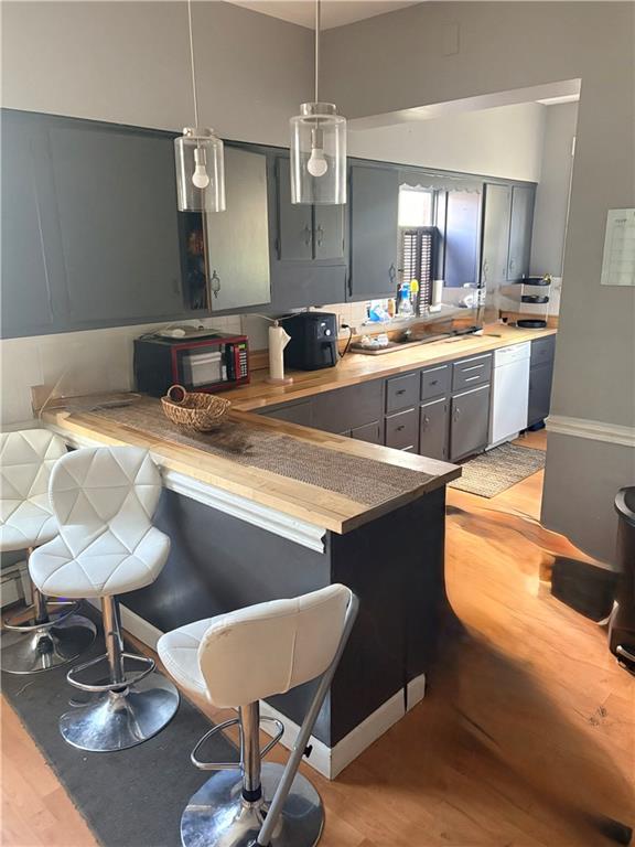 356 Locust Avenue Washington, PA 15301 - Photo 6 of 19 a kitchen with a dining table chairs sink and stove