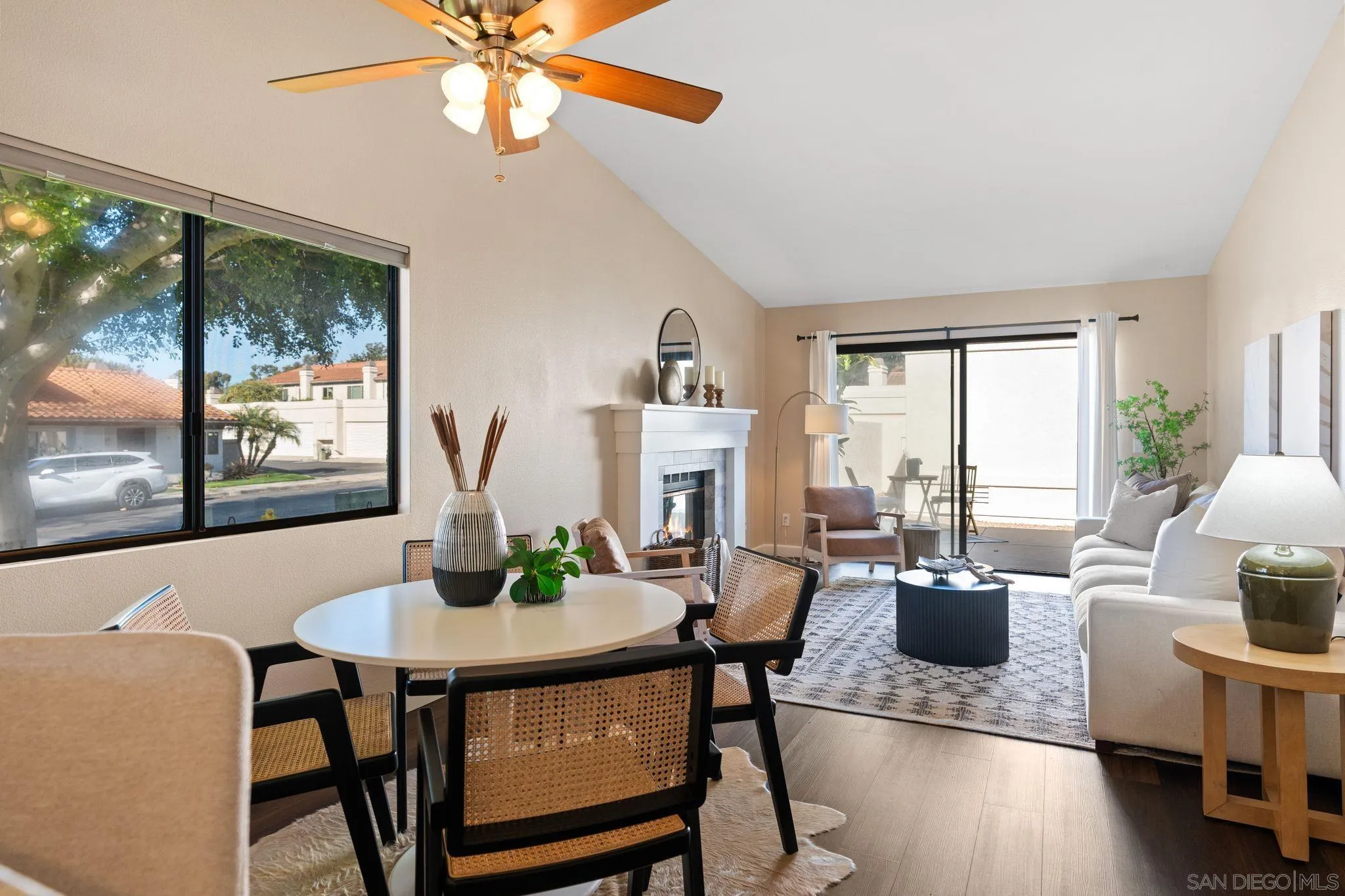 6922 Pear Tree Drive Carlsbad, CA 92011 - Photo 11 of 44 a view of a dining room with furniture window and wooden floor