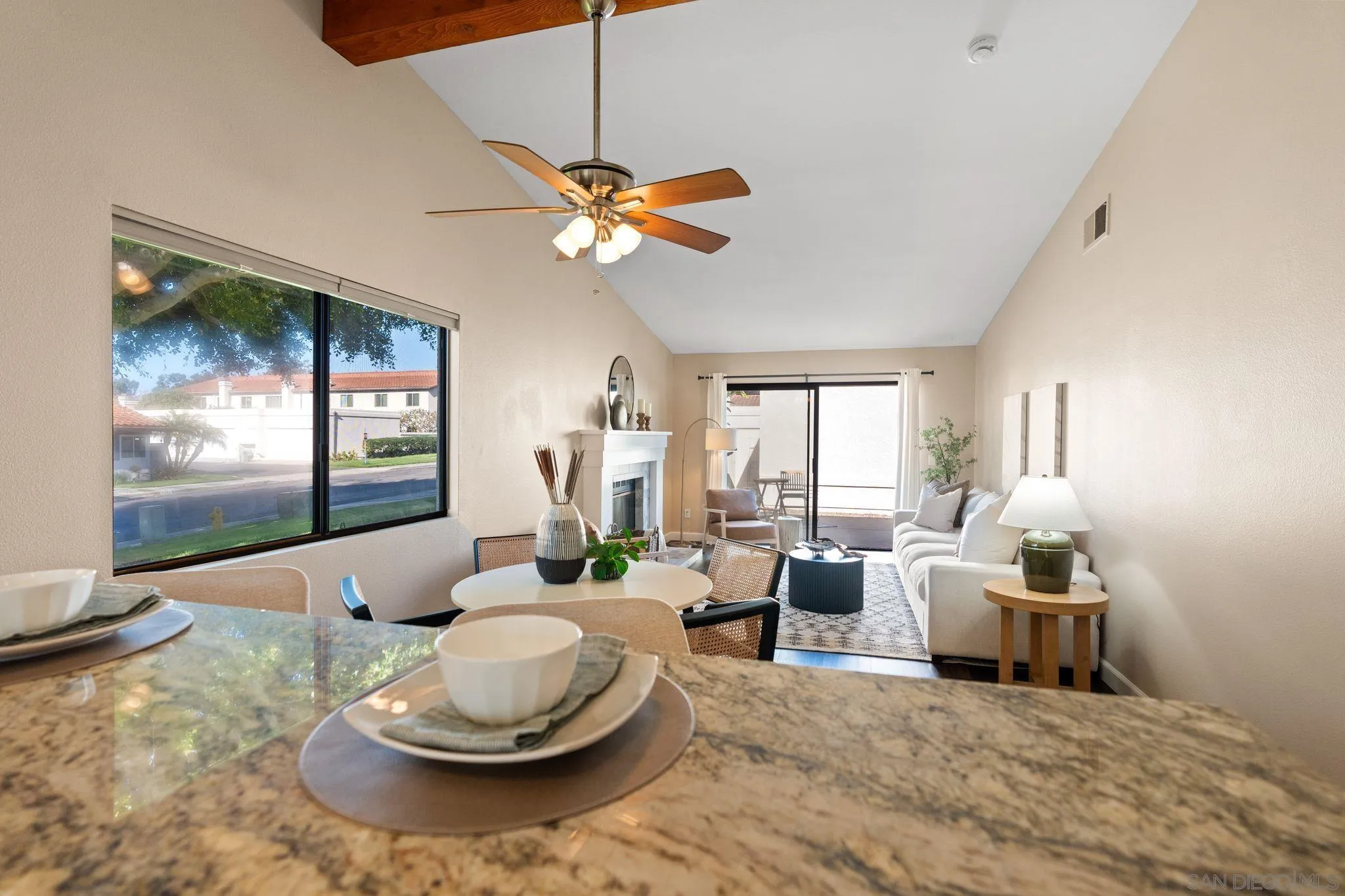 6922 Pear Tree Drive Carlsbad, CA 92011 - Photo 13 of 44 a living room with furniture and a large window
