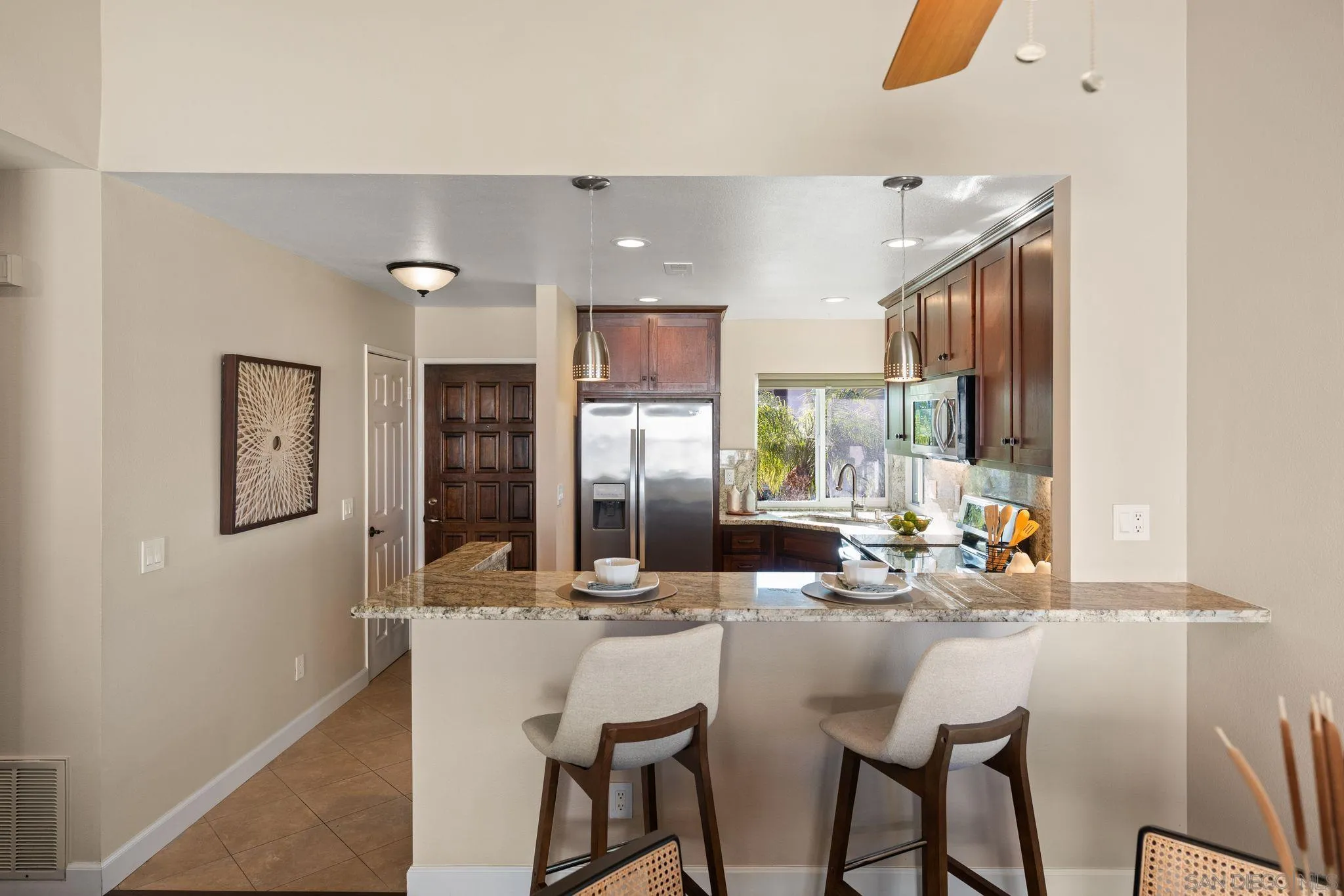 6922 Pear Tree Drive Carlsbad, CA 92011 - Photo 14 of 44 a view of a dining room with furniture window and outside view