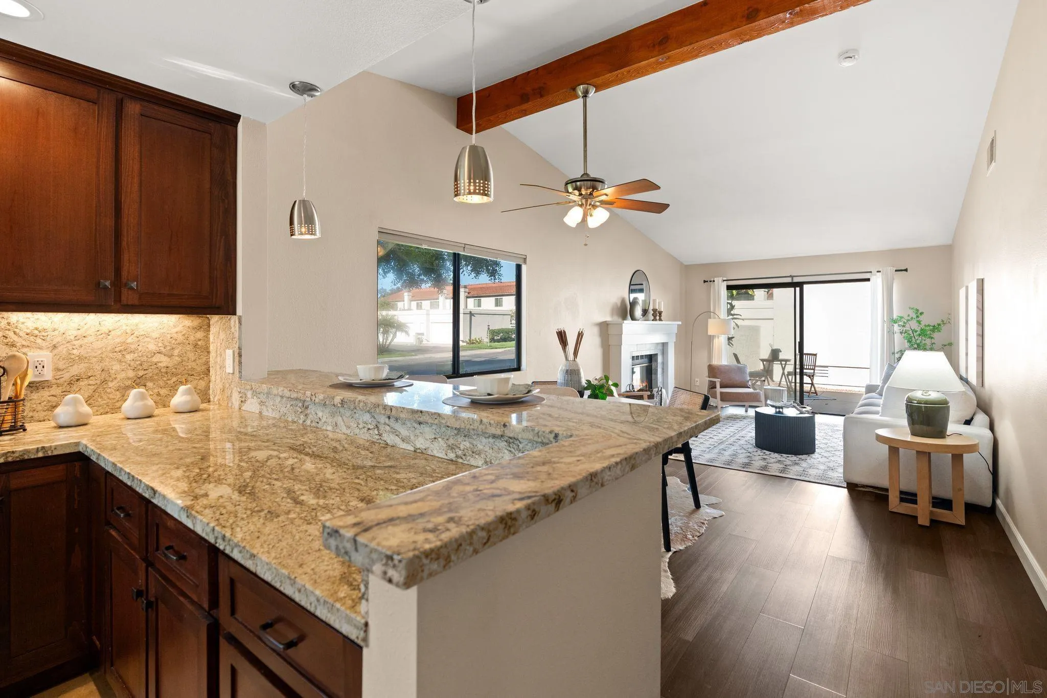 6922 Pear Tree Drive Carlsbad, CA 92011 - Photo 18 of 44 a kitchen with a counter space cabinets and appliances