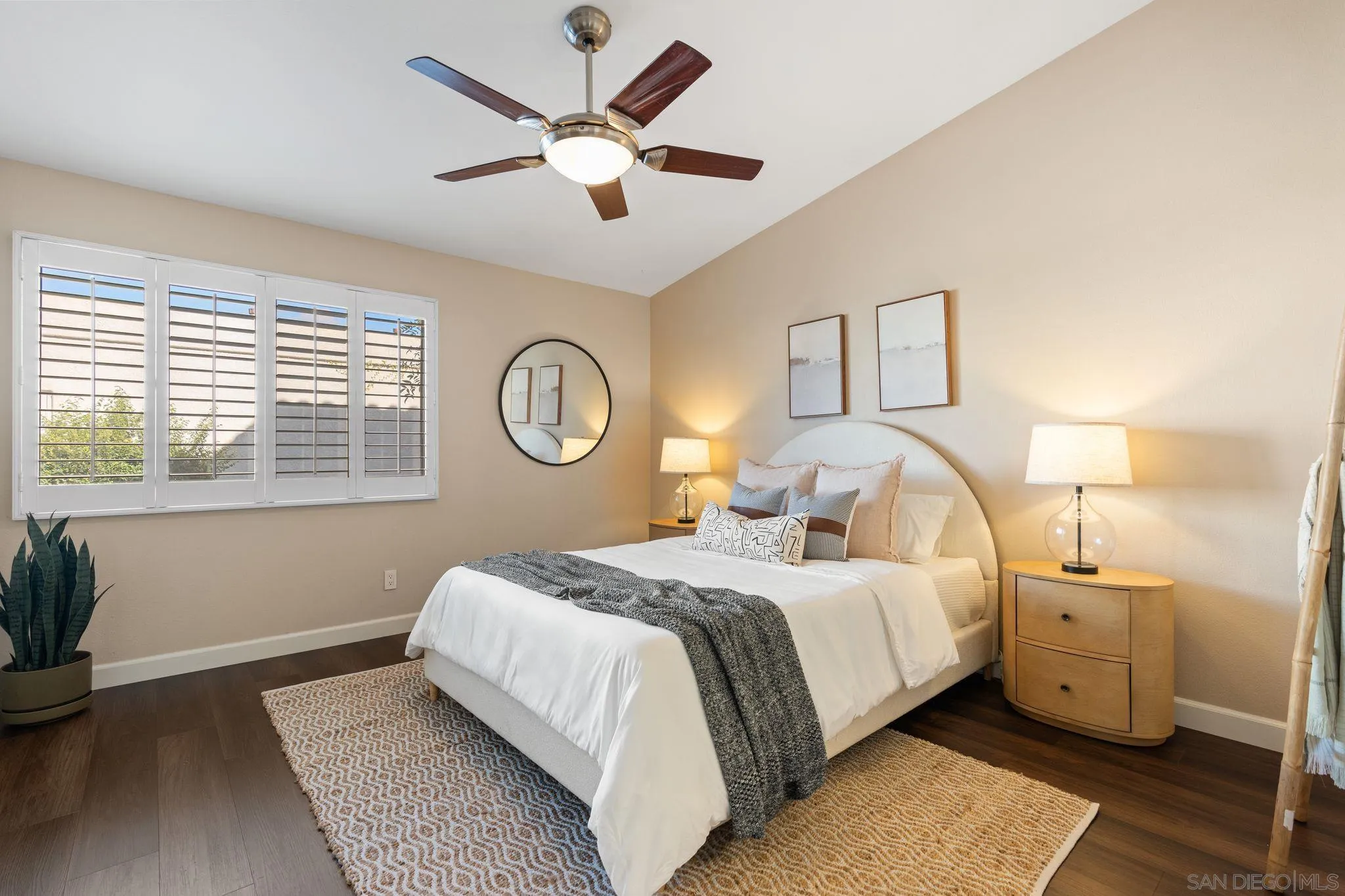 6922 Pear Tree Drive Carlsbad, CA 92011 - Photo 20 of 44 a bedroom with a large bed and a chandelier