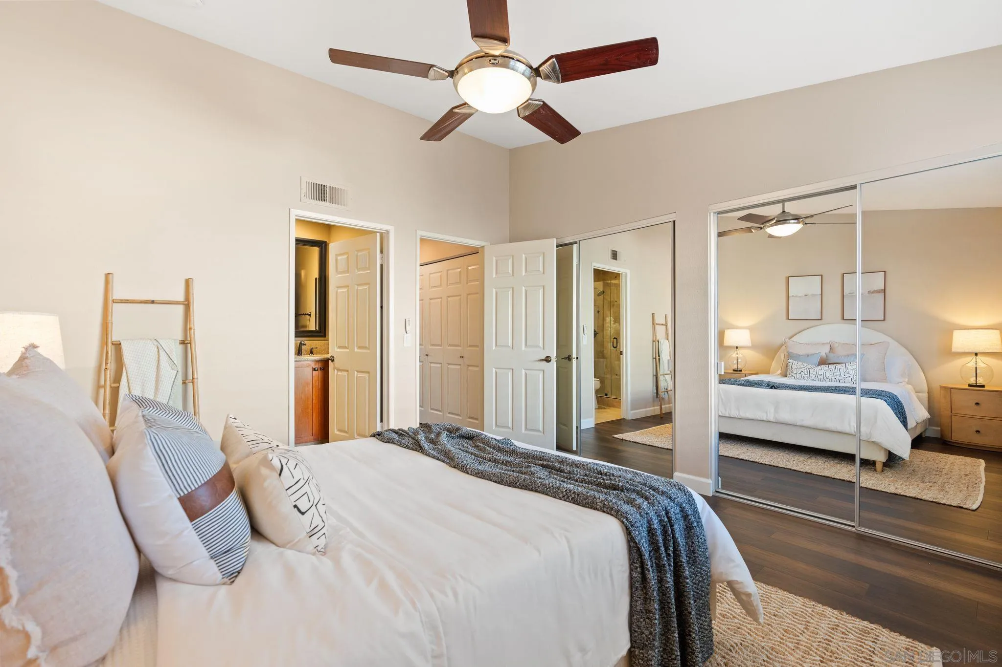 6922 Pear Tree Drive Carlsbad, CA 92011 - Photo 21 of 44 a bedroom with a bed and a chandelier