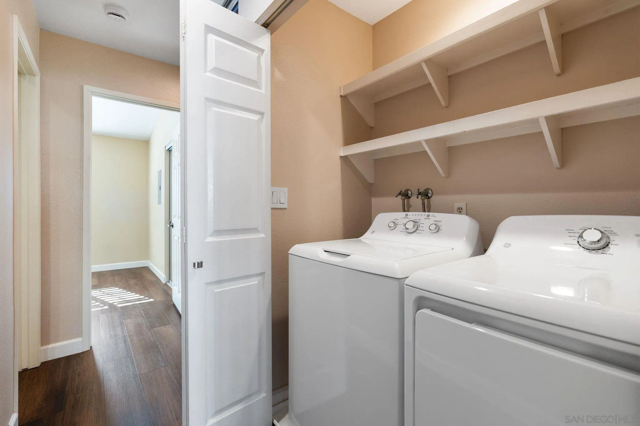 6922 Pear Tree Drive Carlsbad, CA 92011 - Photo 26 of 44 a utility room with dryer and washer