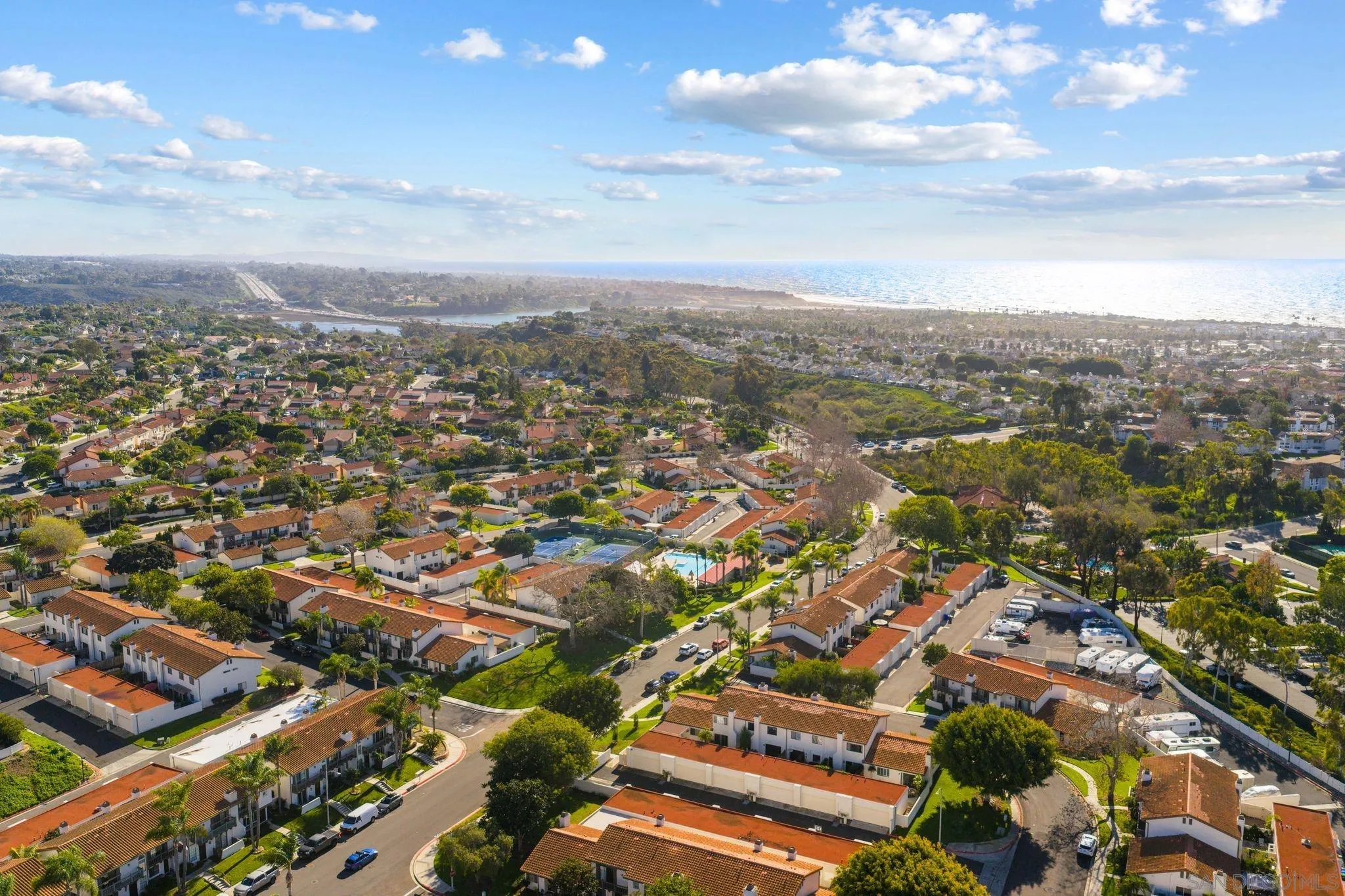 6922 Pear Tree Drive Carlsbad, CA 92011 - Photo 40 of 44 an aerial view of residential building with green space