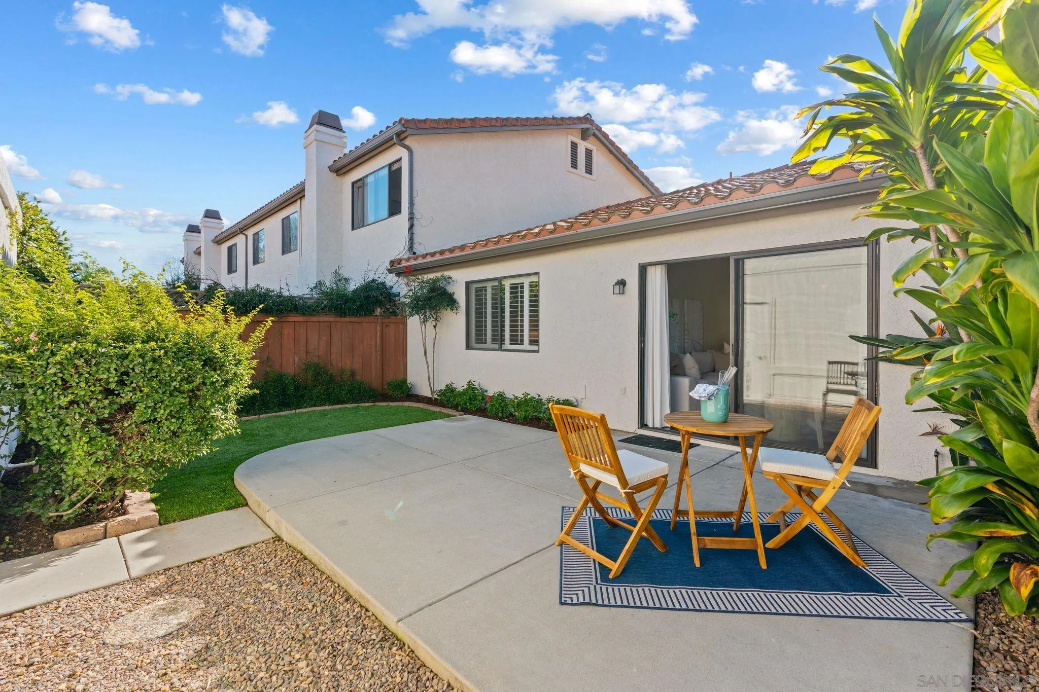 6922 Pear Tree Drive Carlsbad, CA 92011 - Photo 7 of 44 a view of a house with backyard and sitting area