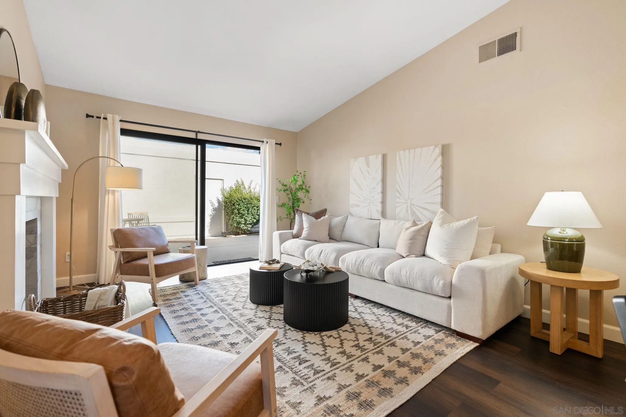 6922 Pear Tree Drive Carlsbad, CA 92011 - Photo 9 of 44 a living room with furniture lamp and a large window
