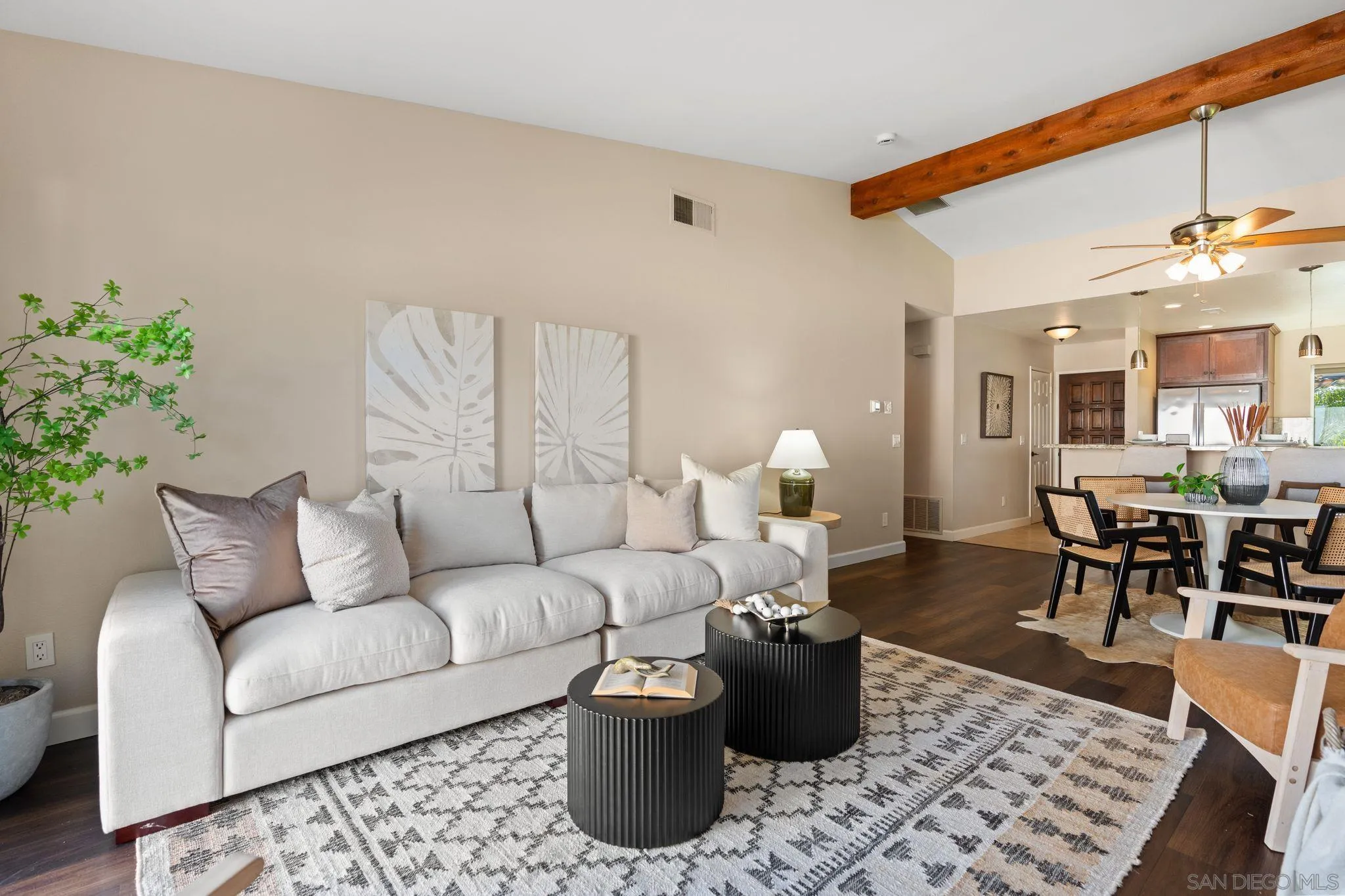 6922 Pear Tree Drive Carlsbad, CA 92011 - Photo 10 of 44 a living room with furniture and wooden floor