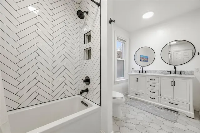 a bathroom with a sink a toilet and a tub