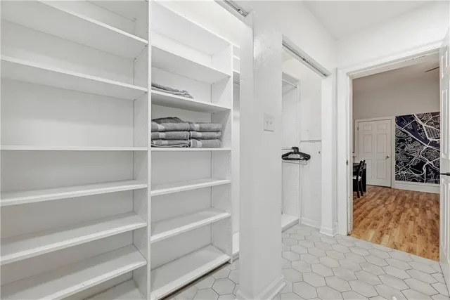 a view of a livingroom with wooden floor and closet