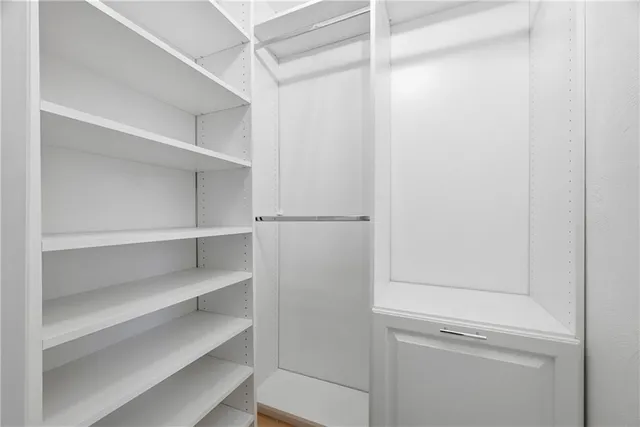 a view of an empty walk in closet