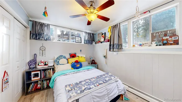 a bedroom with a bed and a book shelf