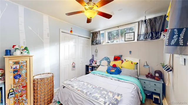 a bedroom that has a bed and a chandelier