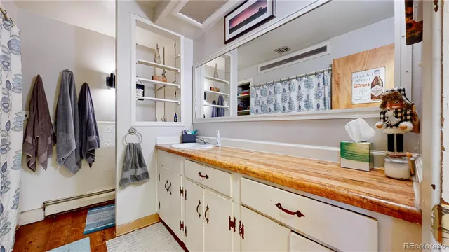 a kitchen with a sink and a refrigerator